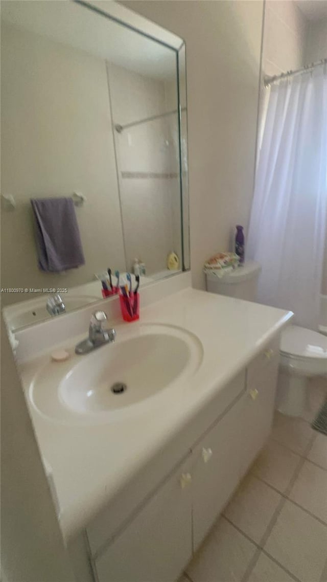 9942 SW 158th Ct, Miami, FL 33196 - full bathroom with toilet, tile patterned flooring, curtained shower, and vanity