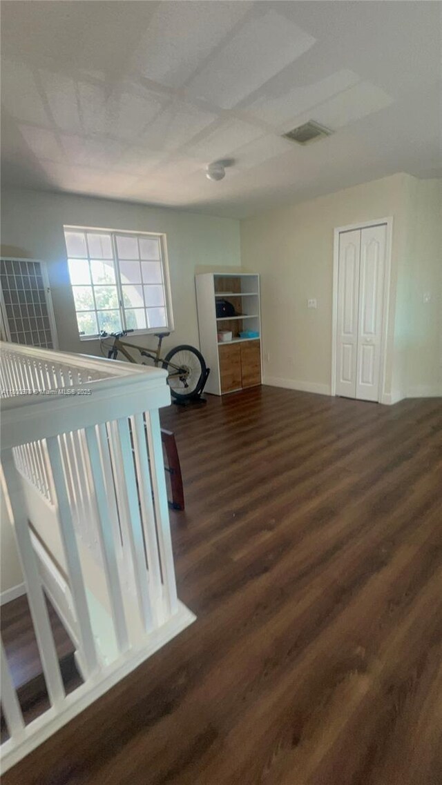 9942 SW 158th Ct, Miami, FL 33196 - staircase featuring wood finished floors and baseboards