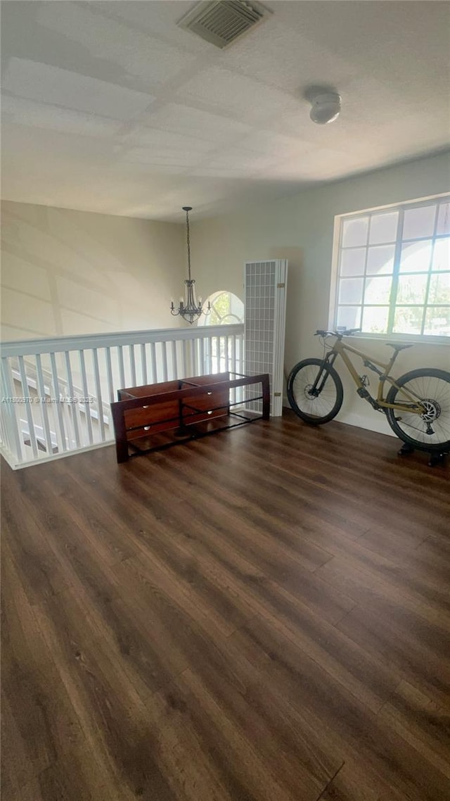 9942 SW 158th Ct, Miami, FL 33196 - spare room with dark wood-type flooring and a chandelier