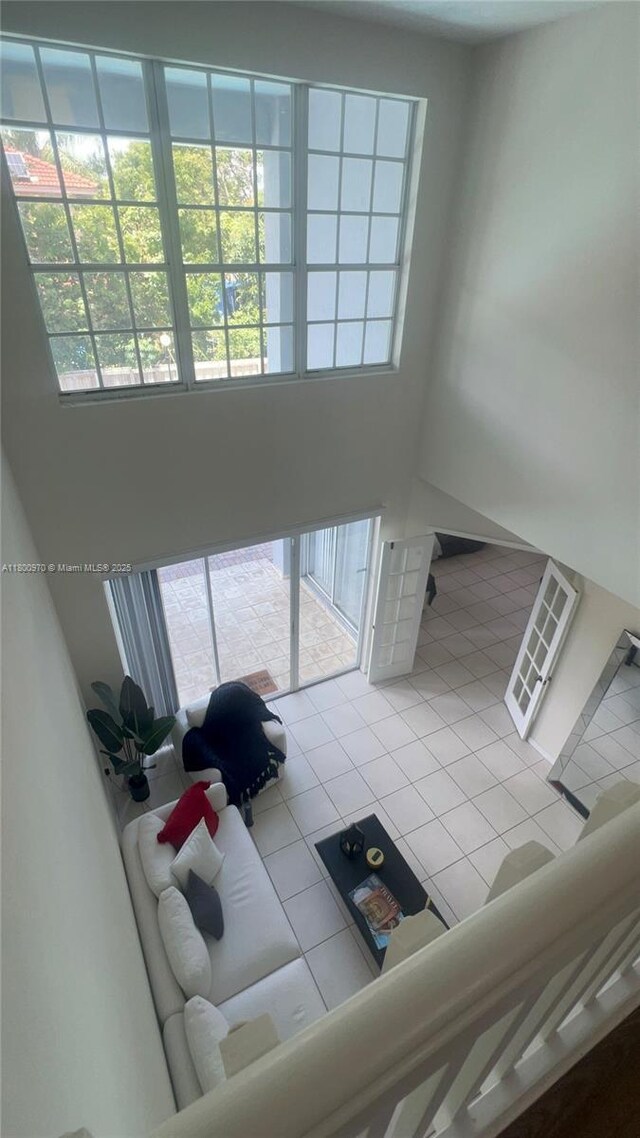 9942 SW 158th Ct, Miami, FL 33196 - tiled living room with a high ceiling