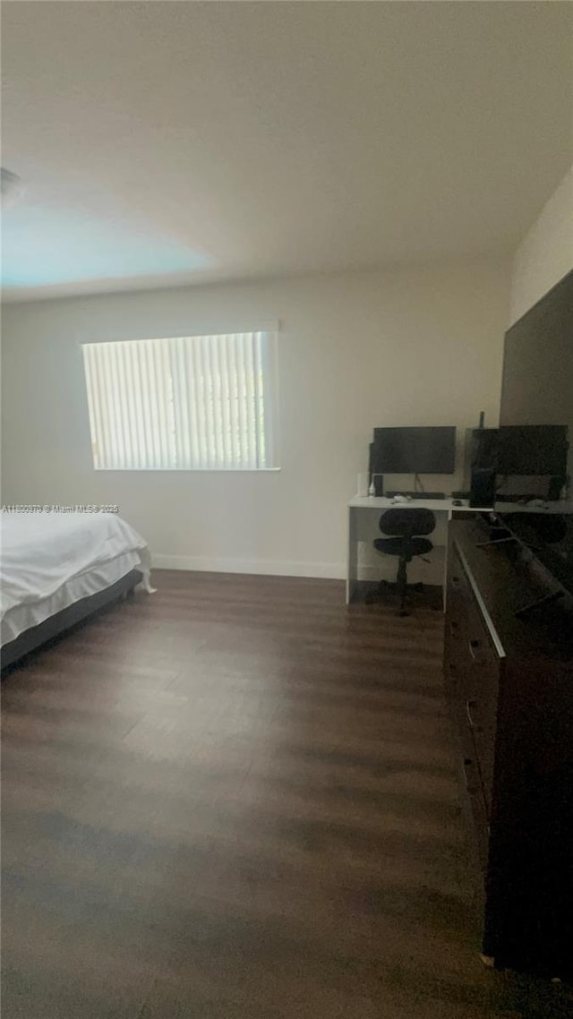 9942 SW 158th Ct, Miami, FL 33196 - bedroom featuring baseboards and dark wood-style floors