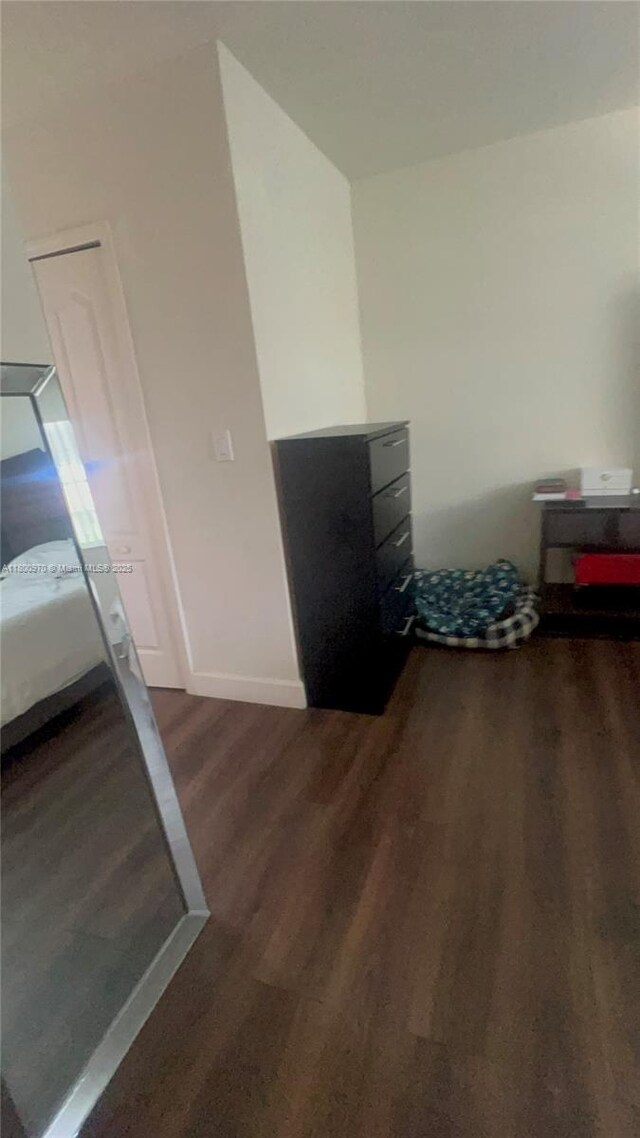 9942 SW 158th Ct, Miami, FL 33196 - unfurnished bedroom with wood finished floors and baseboards