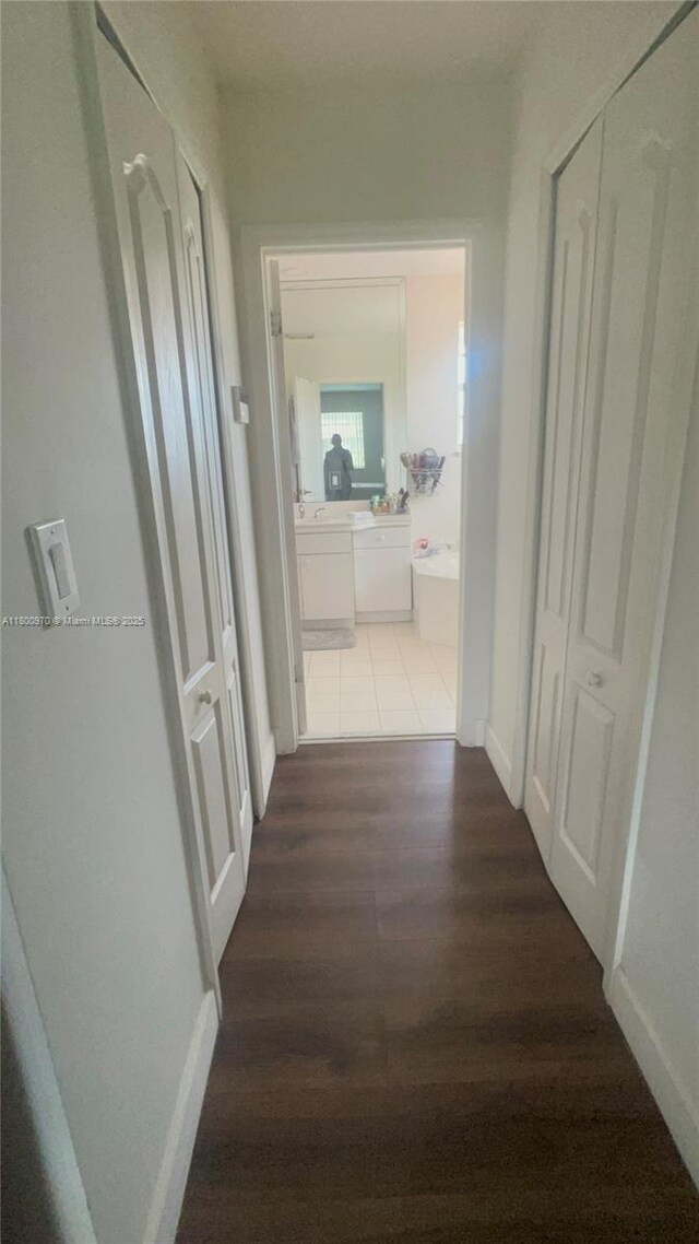 9942 SW 158th Ct, Miami, FL 33196 - corridor featuring dark wood-style flooring and baseboards