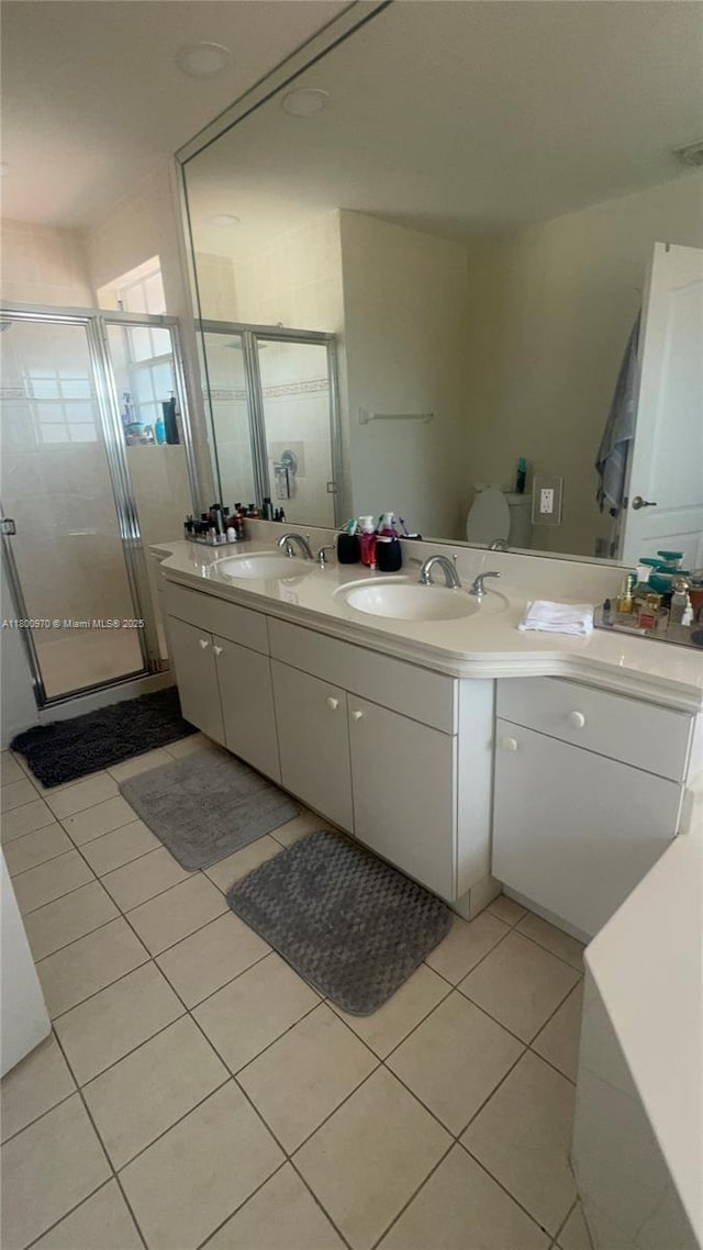 9942 SW 158th Ct, Miami, FL 33196 - full bathroom featuring tile patterned floors, a stall shower, and double vanity