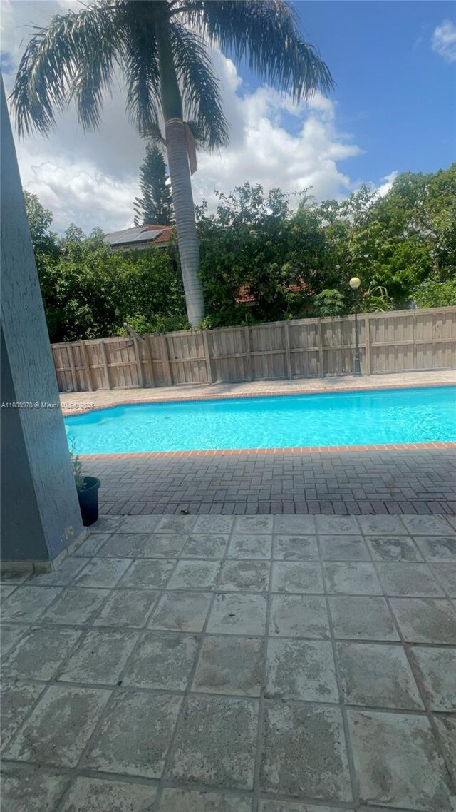 9942 SW 158th Ct, Miami, FL 33196 - view of swimming pool with fence