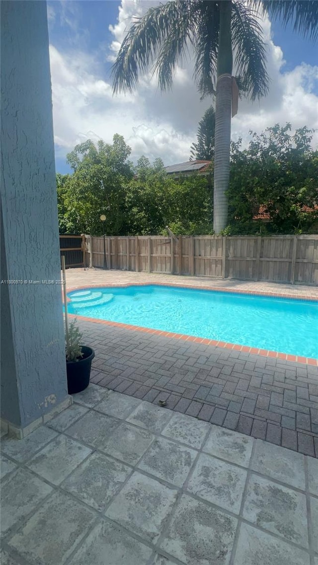 9942 SW 158th Ct, Miami, FL 33196 - view of pool with a fenced backyard and a patio