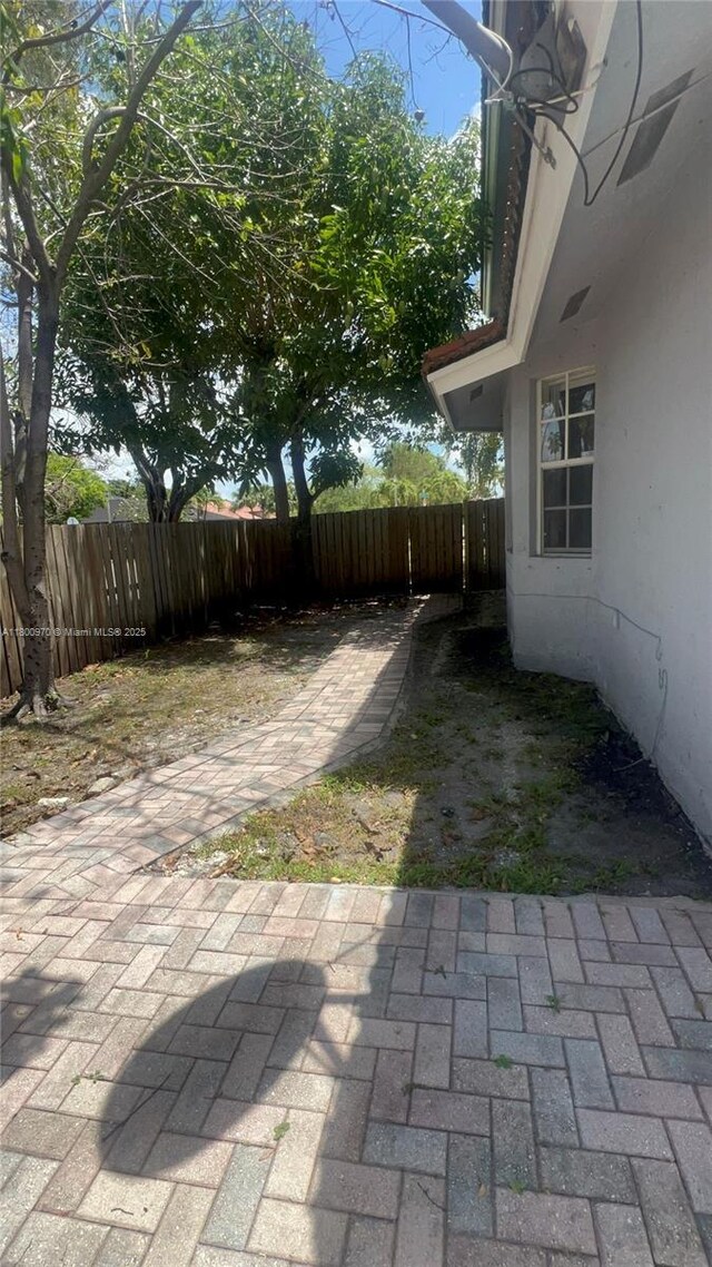 9942 SW 158th Ct, Miami, FL 33196 - view of yard with fence and a patio area