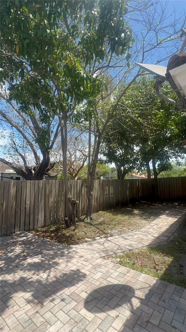 9942 SW 158th Ct, Miami, FL 33196 - fenced backyard featuring a patio area