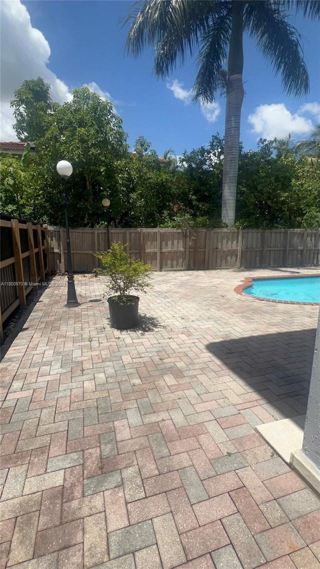 9942 SW 158th Ct, Miami, FL 33196 - view of patio featuring a fenced backyard