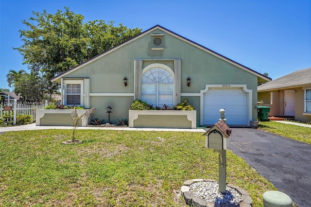 9828 SW 58th Ct, Cooper City, FL 33328 - view of front of property featuring an attached garage and asphalt driveway