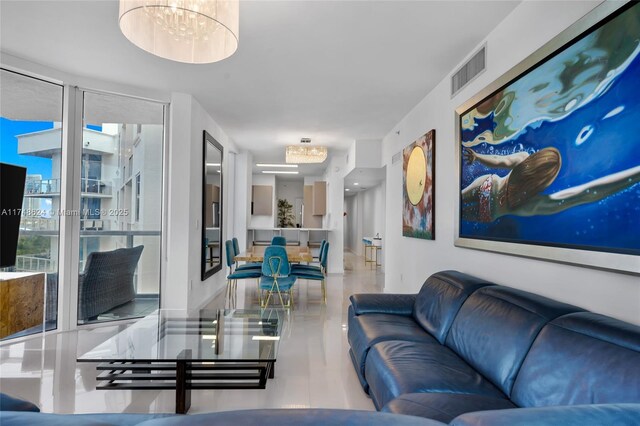 3030 NE 188th St Unit 602, Aventura, FL 33180 - living room featuring a chandelier