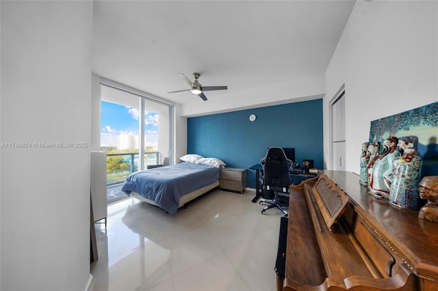 3030 NE 188th St Unit 602, Aventura, FL 33180 - bedroom with an office area, light tile patterned floors, and a ceiling fan