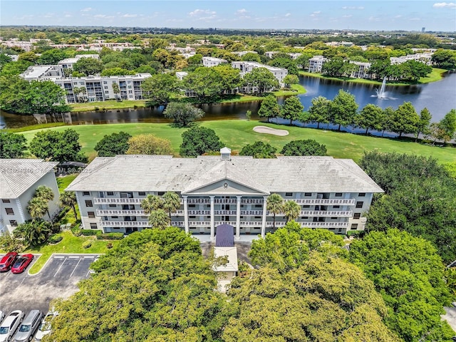 1709 Whitehall Dr Unit 306, Davie, FL 33324 - drone / aerial view of a large body of water, a golf course, apartment complex / building, and a tree filled landscape