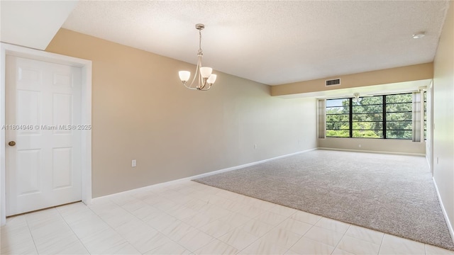 1709 Whitehall Dr Unit 306, Davie, FL 33324 - unfurnished room with light carpet, a textured ceiling, a chandelier, and baseboards