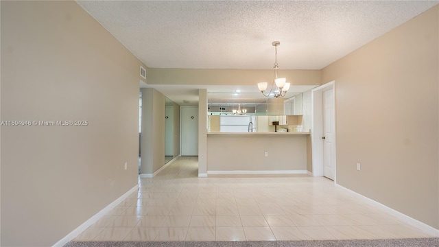 1709 Whitehall Dr Unit 306, Davie, FL 33324 - spare room with a chandelier, baseboards, and a textured ceiling
