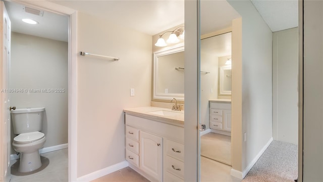 1709 Whitehall Dr Unit 306, Davie, FL 33324 - bathroom with vanity, toilet, and baseboards