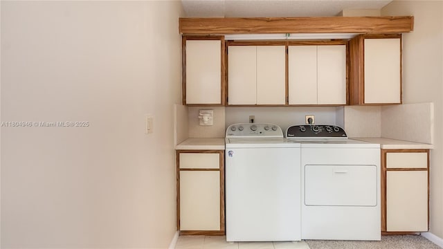 1709 Whitehall Dr Unit 306, Davie, FL 33324 - laundry room featuring independent washer and dryer, cabinet space, and baseboards