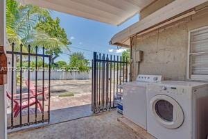 3275 NW 95th St, Miami, FL 33147 - laundry area featuring washing machine and clothes dryer