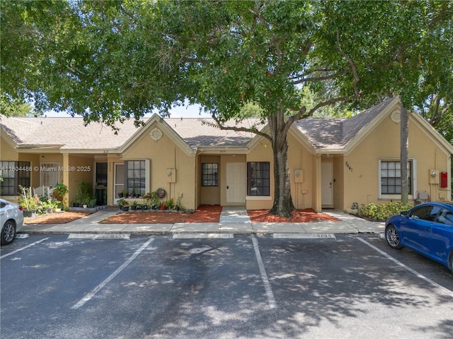3639 NW 83rd Ln, Sunrise, FL 33351 - view of front of home featuring stucco siding, uncovered parking, and a shingled roof