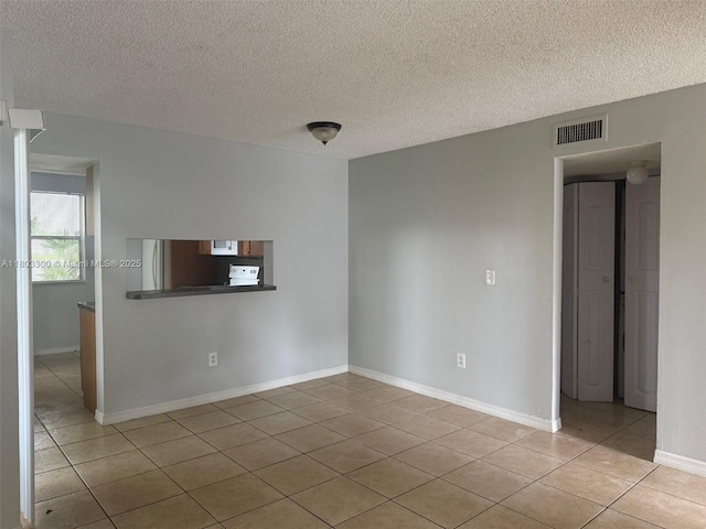 1100 Constitution Dr Unit 1100G, Homestead, FL 33034 - unfurnished room featuring light tile patterned floors and a textured ceiling