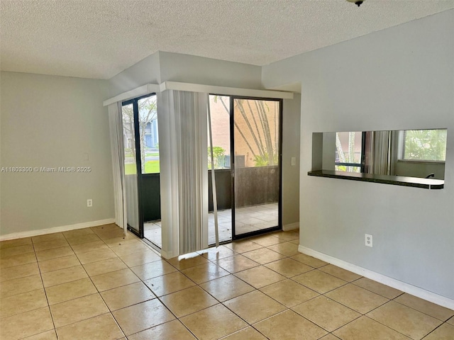 1100 Constitution Dr Unit 1100G, Homestead, FL 33034 - tiled spare room with plenty of natural light and a textured ceiling