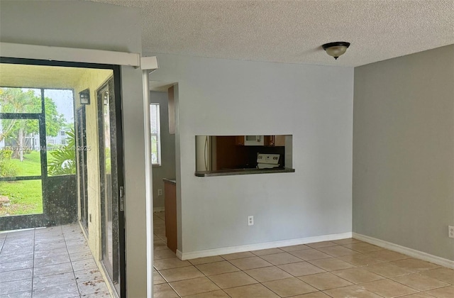 1100 Constitution Dr Unit 1100G, Homestead, FL 33034 - empty room featuring light tile patterned floors and a textured ceiling
