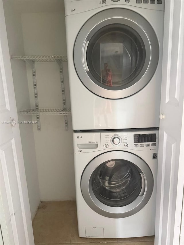 1100 Constitution Dr Unit 1100G, Homestead, FL 33034 - laundry room featuring stacked washer / drying machine and tile patterned floors
