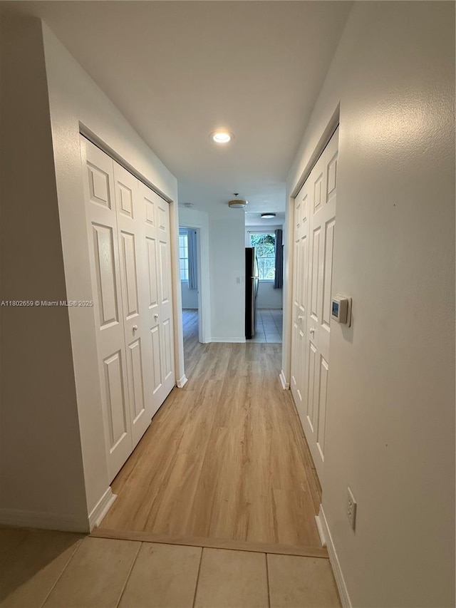 616 Clearwater Park Rd Unit 212, West Palm Beach, FL 33401 - corridor with baseboards, recessed lighting, and light tile patterned floors