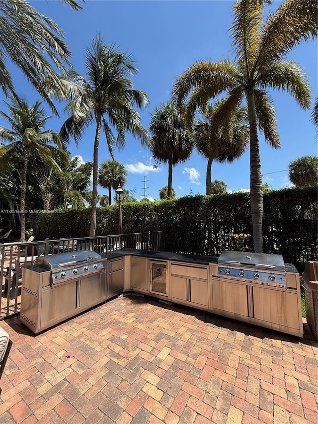 616 Clearwater Park Rd Unit 212, West Palm Beach, FL 33401 - view of patio / terrace featuring exterior kitchen and a grill
