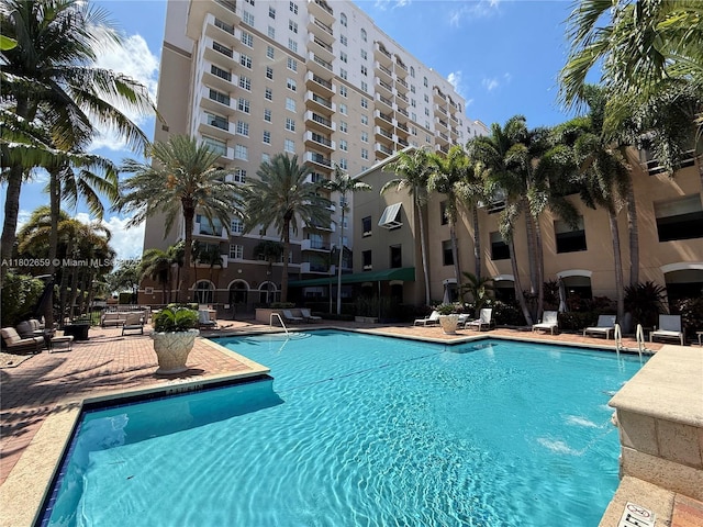 616 Clearwater Park Rd Unit 212, West Palm Beach, FL 33401 - community pool with a patio