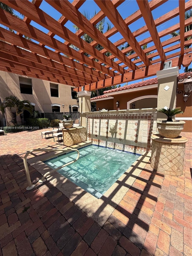 616 Clearwater Park Rd Unit 212, West Palm Beach, FL 33401 - view of swimming pool with a pergola and a patio