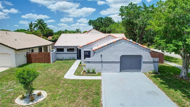 11955 Brim Way, Cooper City, FL 33026 - view of front of property featuring a tile roof, stucco siding, decorative driveway, and a garage