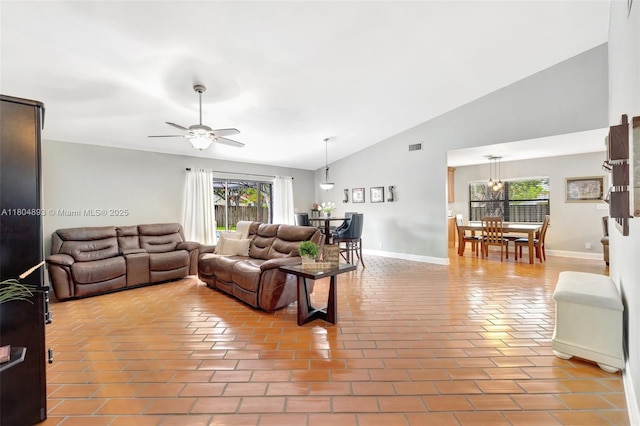 11955 Brim Way, Cooper City, FL 33026 - living room with healthy amount of natural light, high vaulted ceiling, ceiling fan, and a chandelier