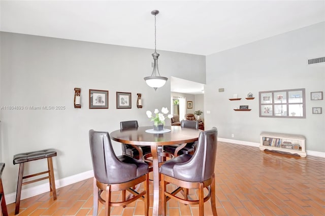 11955 Brim Way, Cooper City, FL 33026 - dining room with brick floors and lofted ceiling