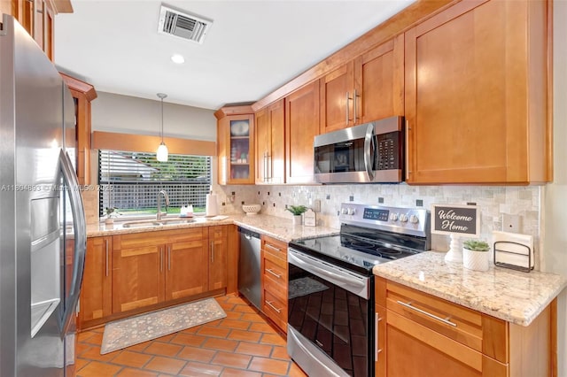 11955 Brim Way, Cooper City, FL 33026 - kitchen featuring stainless steel appliances, decorative backsplash, glass insert cabinets, light stone countertops, and recessed lighting