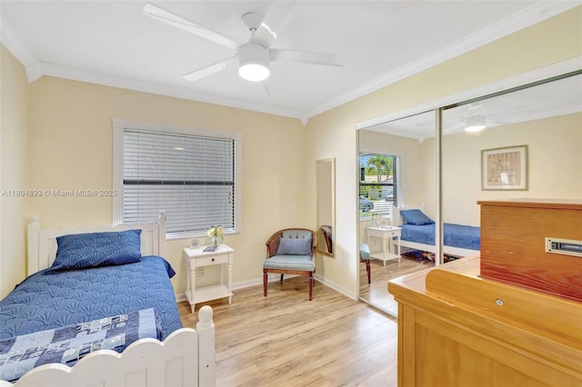 11955 Brim Way, Cooper City, FL 33026 - bedroom featuring crown molding, light wood-type flooring, a closet, and a ceiling fan