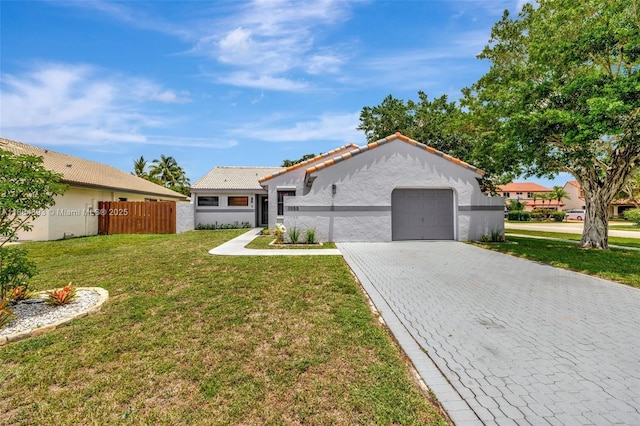 11955 Brim Way, Cooper City, FL 33026 - mediterranean / spanish house featuring stucco siding, decorative driveway, an attached garage, and a tile roof