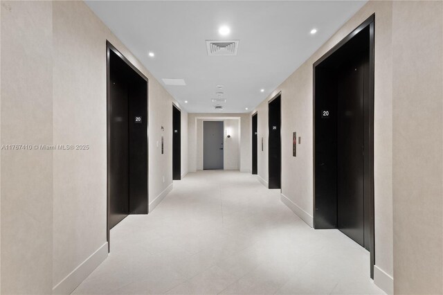 601 NE 1st Ave Unit 2004, Miami, FL 33132 - hall with elevator, recessed lighting, and baseboards
