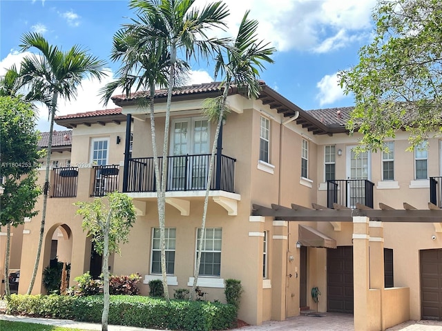 8716 Blaze Ct, Davie, FL 33328 - view of building exterior with a garage and driveway