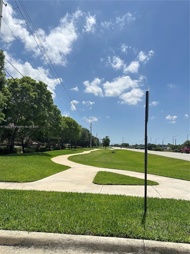 8716 Blaze Ct, Davie, FL 33328 - view of home's community with a yard