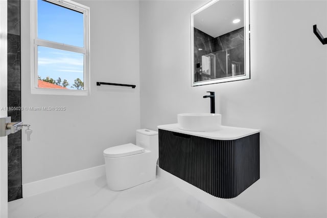 418 8th Ave, Lehigh Acres, FL 33972 - bathroom with toilet and vanity