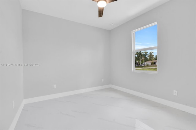 418 8th Ave, Lehigh Acres, FL 33972 - spare room with marble finish floors, ceiling fan, and baseboards