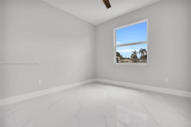 418 8th Ave, Lehigh Acres, FL 33972 - empty room with marble finish flooring and baseboards