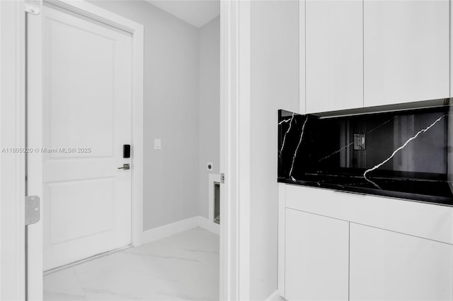 418 8th Ave, Lehigh Acres, FL 33972 - clothes washing area with marble look tiles and baseboards