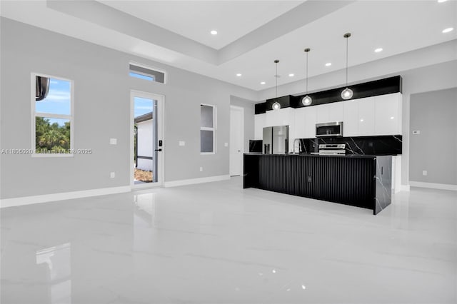 418 8th Ave, Lehigh Acres, FL 33972 - kitchen with appliances with stainless steel finishes, dark countertops, modern cabinets, white cabinets, and recessed lighting