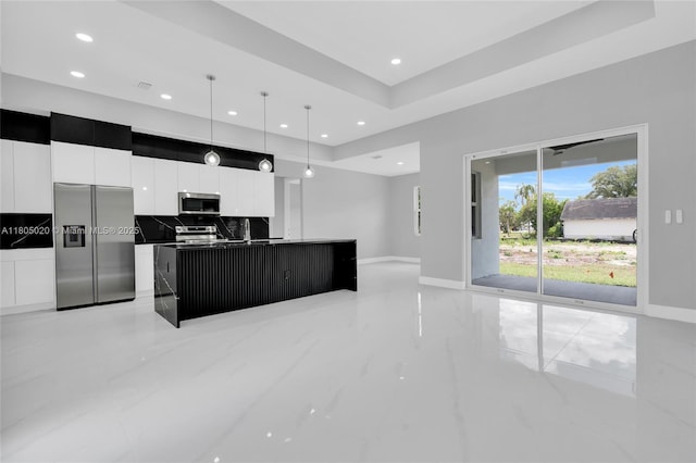 418 8th Ave, Lehigh Acres, FL 33972 - kitchen with appliances with stainless steel finishes, recessed lighting, modern cabinets, white cabinetry, and a kitchen island with sink