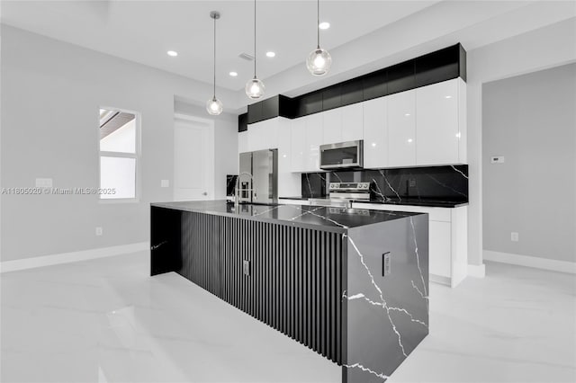 418 8th Ave, Lehigh Acres, FL 33972 - kitchen featuring appliances with stainless steel finishes, white cabinetry, modern cabinets, recessed lighting, and baseboards
