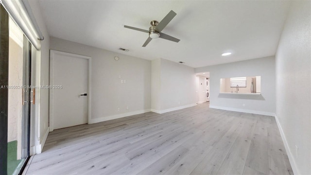 15805 W Waterside Cir Unit 202, Sunrise, FL 33326 - unfurnished living room featuring a ceiling fan, light wood finished floors, baseboards, and recessed lighting