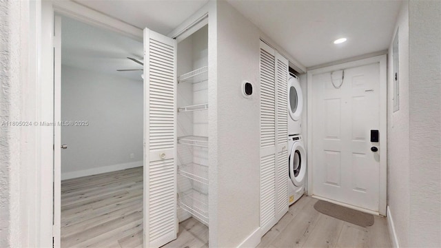 15805 W Waterside Cir Unit 202, Sunrise, FL 33326 - laundry area with estacked washer and dryer, light wood-style floors, baseboards, recessed lighting, and ceiling fan
