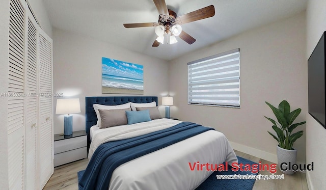 15805 W Waterside Cir Unit 202, Sunrise, FL 33326 - bedroom with wood finished floors, a closet, baseboards, and a ceiling fan